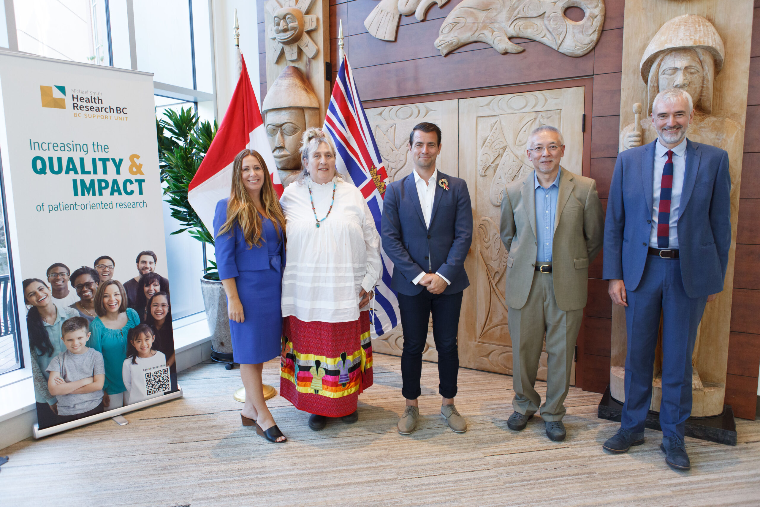 Representatives from Island Health, Curve Lake First Nations, the federal government and Michael Smith Health Research BC stand in front of the All Nations Healing Room at Royal Jubilee Hospital, Victoria BC.