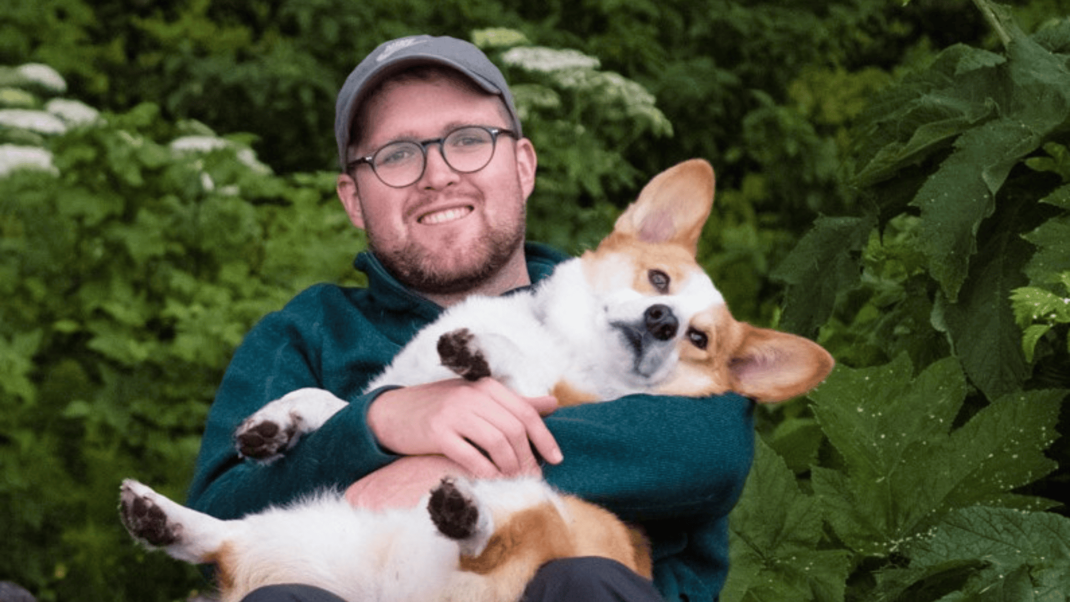 Photo of Dr. Kiffer Card holding a corgi dog