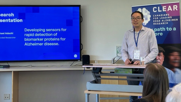 Dr. Michael Adachi giving a presentation titled: "Developing sensors for rapid detection of biomarker proteins for Alzheimer disease".