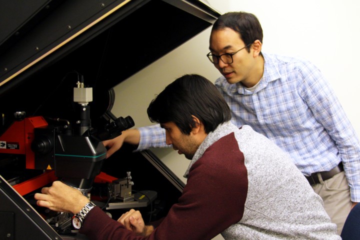 Photo: Dr. Michael Adachi (right) and research student Amin Abnavi placing probes on a sensor to perform electrical testing.