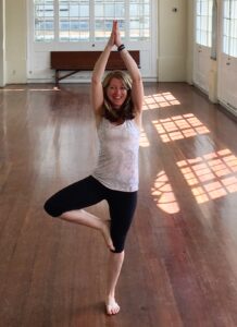 Sarah Greene doing yoga in New Orleans, indoors